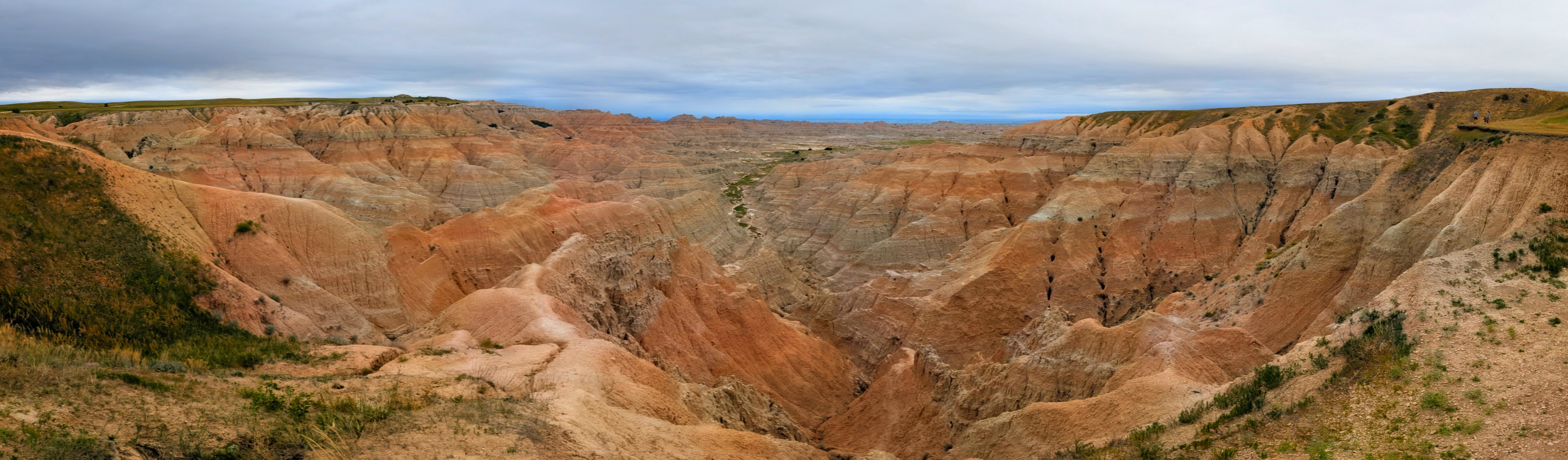 Eroded Badlands formations under midday sun